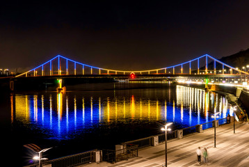 Bridge with blue and yellow light at night