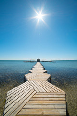 Wooden pier in the Lesser Sea for light boats in Murcia, Spain