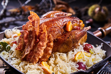 Crispy golden roast pheasant with bacon and orange