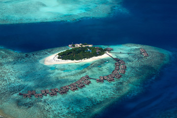 aerial view of tropical paradise maldives island resort with coral reef turquoise blue ocean tourism background