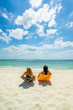 Woman enjoying her holidays on a transat at the tropical beach