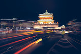 Xian bell tower at night, long exposure with car light tracks, color toning applied, China.