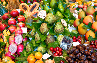 Fresh fruits in the market. Exotic fresh fruits on a market.Blueberry, papaya, dragon fruit, kiwi, passion fruit.