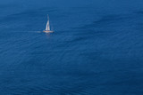 White yacht on blue sea background