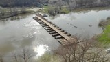 4k Aerial view on the pontoon bridge across the river.