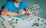 child making geometric shapes, engineering and STEM