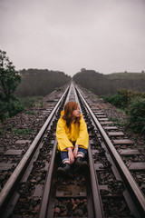 Girl in the train tracks