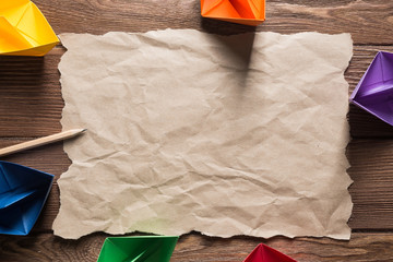 Concept of inspiration and creativity with paper ships. Place your text