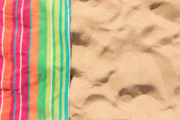 Beach towel on sandy tropical beach
