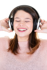 young woman with headphones and eyes closed smiling happy