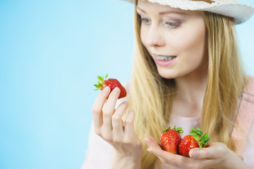 Young woman with fresh strawberries