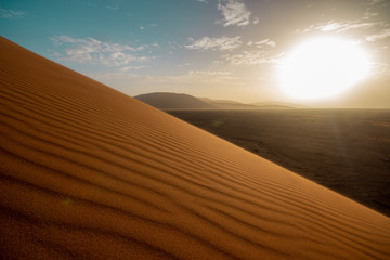 Sunset over desert dune