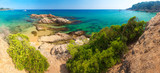 Spain beach. Costa brava resort beach. Rocks in sandy beach Cala Treumal and Santa Cristina in Lloret de Mar