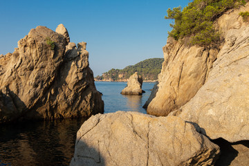 Costa Brava seascape. Spain coast. Rocks and cliffs in sea beach in Lloret de Mar in the morning