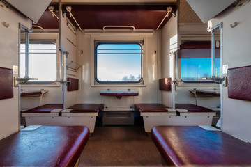 Empty passenger compartment in a moving train.
