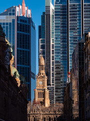 Old stone building and tall business buildings in downtown Sydney