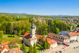 Croatia, Slavonia, town of Daruvar, main square and orthodox church in spring, panoramic drone view