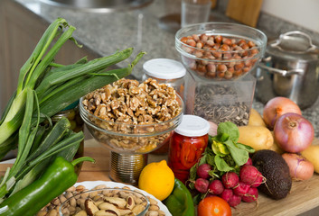 Vegetables and nuts on kitchen tabletop