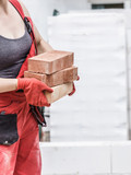 Woman working with bricks
