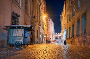 Old buildings in the historic district of Krakow at night