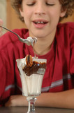 boy with hot fudge sundae, selective focus