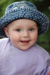 Baby Smiled in blue jean hat von Alexander Kretov, lizenzfreies Foto ...