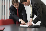 Business men working in an office.