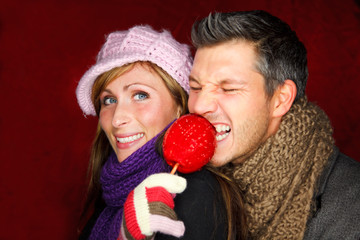 couple candy taffy apple christmas <b>holiday market</b> fair - 240_F_18880548_0MNiEI6AdpPs2EgsFGt3WYQY9pq8KEGA