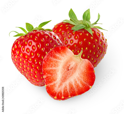 Isolated strawberries. Three strawberry fruits, one cut in half isolated on white background © Anna Kucherova