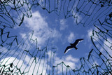 Sky viewed from shattered glass - symbol for freedom