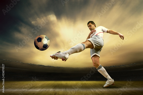 Fototapeta Shoot of football player on the outdoor field