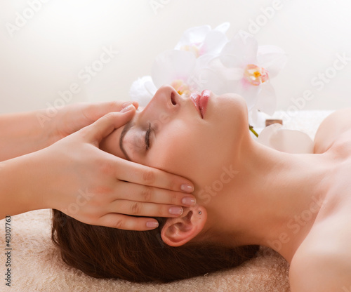 Lacobel Spa Massage. Young Woman Getting Facial Massage