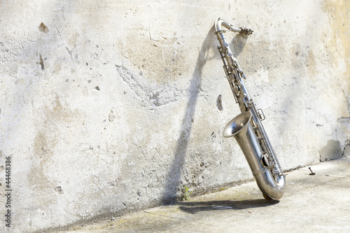  sax in front of a vintage wall