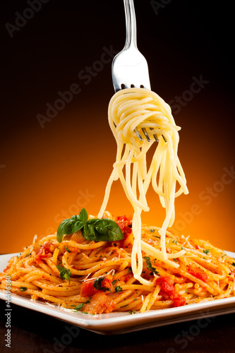 Fototapeta Pasta with tomato sauce and parmesan
