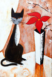Chat noire avec un fleur