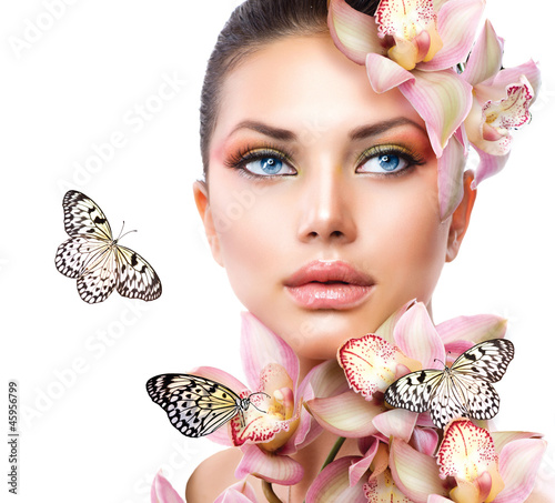 Fototapeta Beautiful Girl With Orchid Flowers and Butterfly