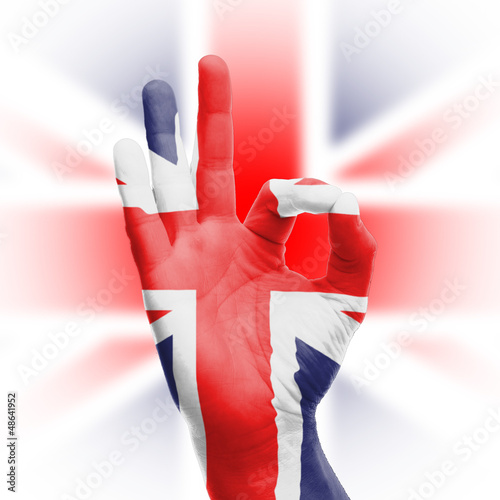 Fototapeta Hand OK sign with UK flag