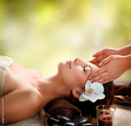 Fototapeta Spa Massage. Young Woman Getting Facial Massage