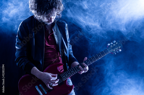 Fototapeta Young Man Playing Electric Guitar