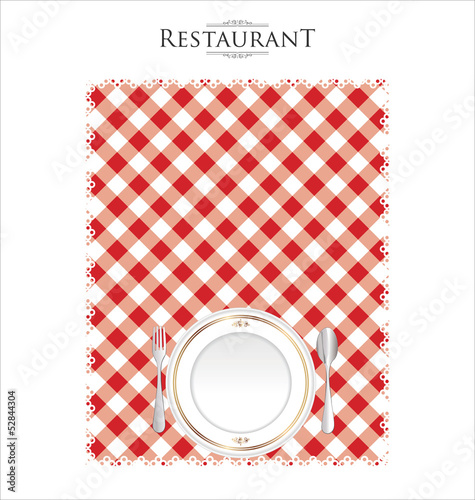 Fototapeta White plate on a checkered red tablecloth
