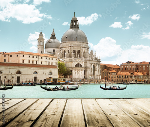 Fototapeta Basilica Santa Maria della Salute, Venice, Italy and wooden surf