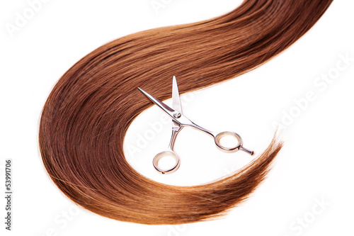 Fototapeta hairdresser scissors on the hair