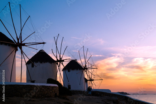  Sunset with famous windmills on Mykonos island, Greece