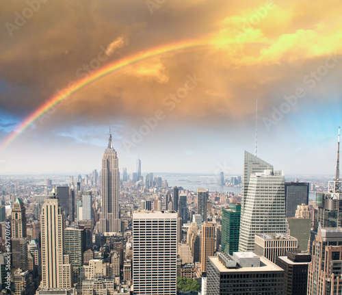 Fototapeta Rainbow over Manhattan sky, beautiful skyline of New York at sun