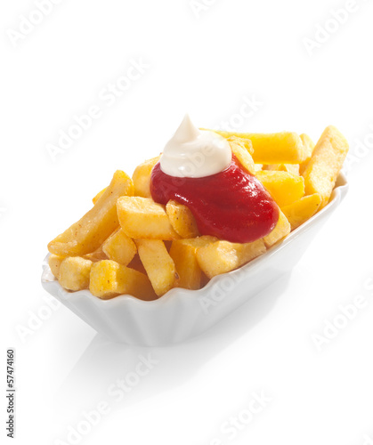Fototapeta Fried potato chips with ketchup and mayo