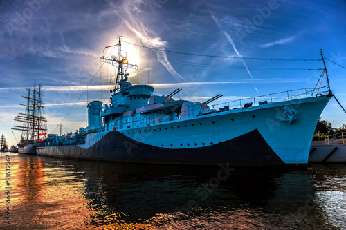 Fototapeta Warship in the port of dramatic scenery. Gdynia, Poland.