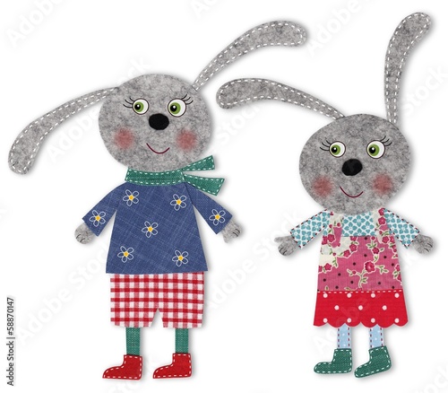 Fototapeta pair of bunnies cut out of felt and wool