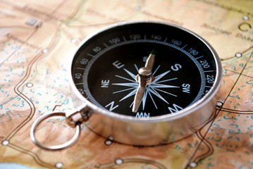 Handheld compass on a map