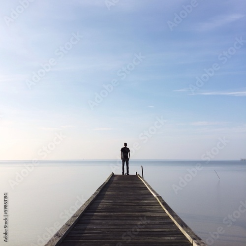 people standing on jetty