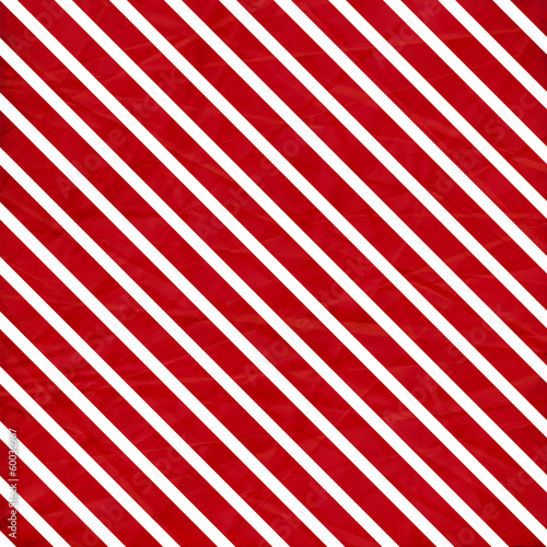 Fototapeta A crumpled paper in a red and white stripe pattern for use as a
